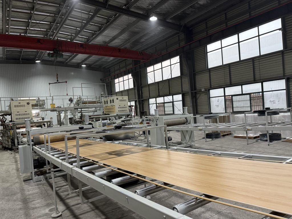 Flooring panels moving through a production line